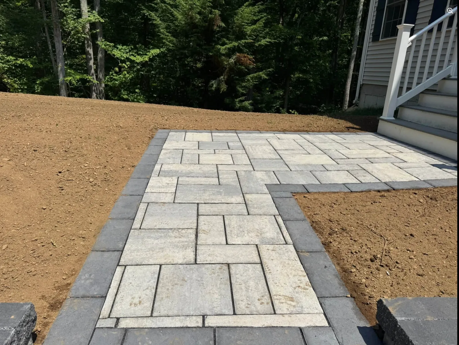 Finished paver walkway and landing beside a New Hampshire home